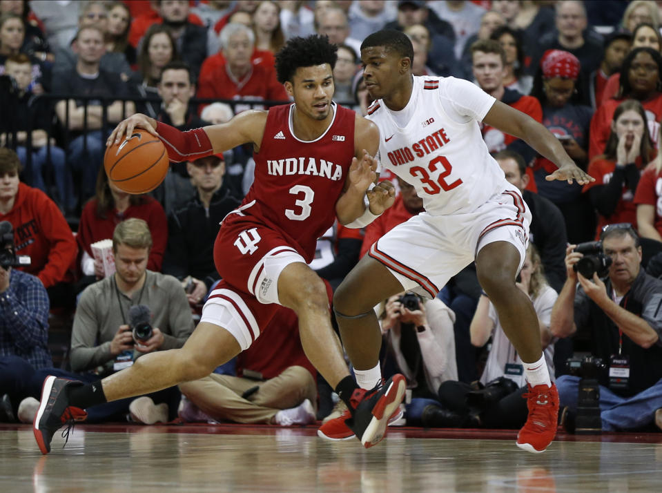 Indiana's Justin Smith, left, posts up against Ohio State's E.J. Liddell during the second half of an NCAA college basketball game Saturday, Feb. 1, 2020, in Columbus, Ohio. Ohio State beat Indiana 68-59. (AP Photo/Jay LaPrete)