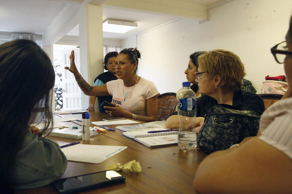 In this Aug. 17, 2019 photo, trans rights activist Kenya Cuevas speaks to former female inmates about reintegration into the job market during a workshop organized by the Women for Justice, in Mexico City. Cuevas is one of the most visible trans activists in Mexico among a growing chorus of women seeking change from the government. (AP Photo/Ginnette Riquelme)