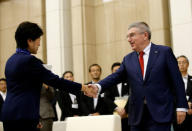 IOC President Thomas Bach (R) meets Tokyo Governor Yuriko Koike at Tokyo Metropolitan Government Building in Tokyo, Japan, October 18, 2016. REUTERS/Kim Kyung-Hoon