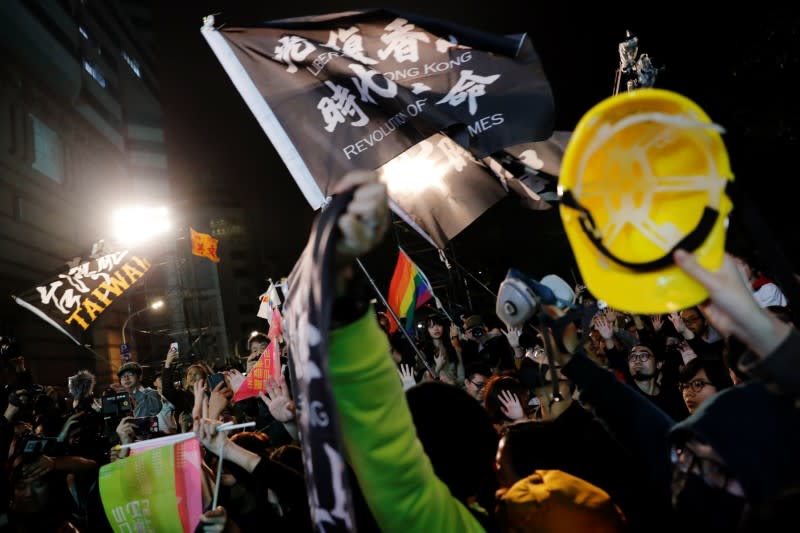 Hong Kong anti-government protesters attend a rally in support of Taiwan President Tsai Ing-wen outside the Democratic Progressive Party (DPP) headquarters in Taipei