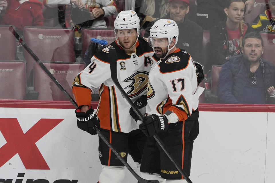 Anaheim Ducks left wing Alex Killorn (17) celebrates his goal with defenseman Cam Fowler (4) during the first period of an NHL hockey game against the Florida Panthers, Monday, Jan. 15, 2024, in Sunrise, Fla. (AP Photo/Marta Lavandier)