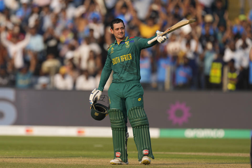 South Africa's Quinton De Kock celebrates his century during the ICC Men's Cricket World Cup match between New Zealand and South Africa in Pune, India, Wednesday, Nov.1, 2023. (AP Photo/Manish Swarup)