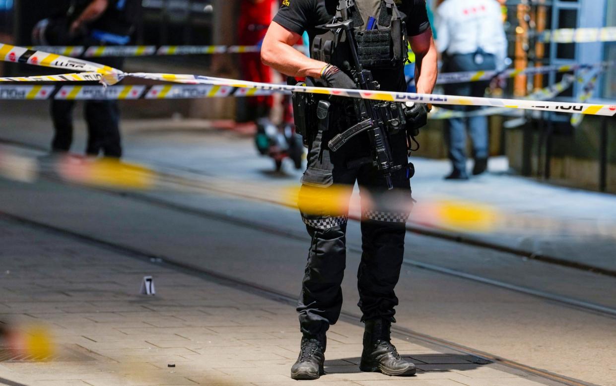 A member of the security forces at the site of a shooting at the London Pub in central Oslo, Norway - Javad Parsa/NTB/via REUTERS