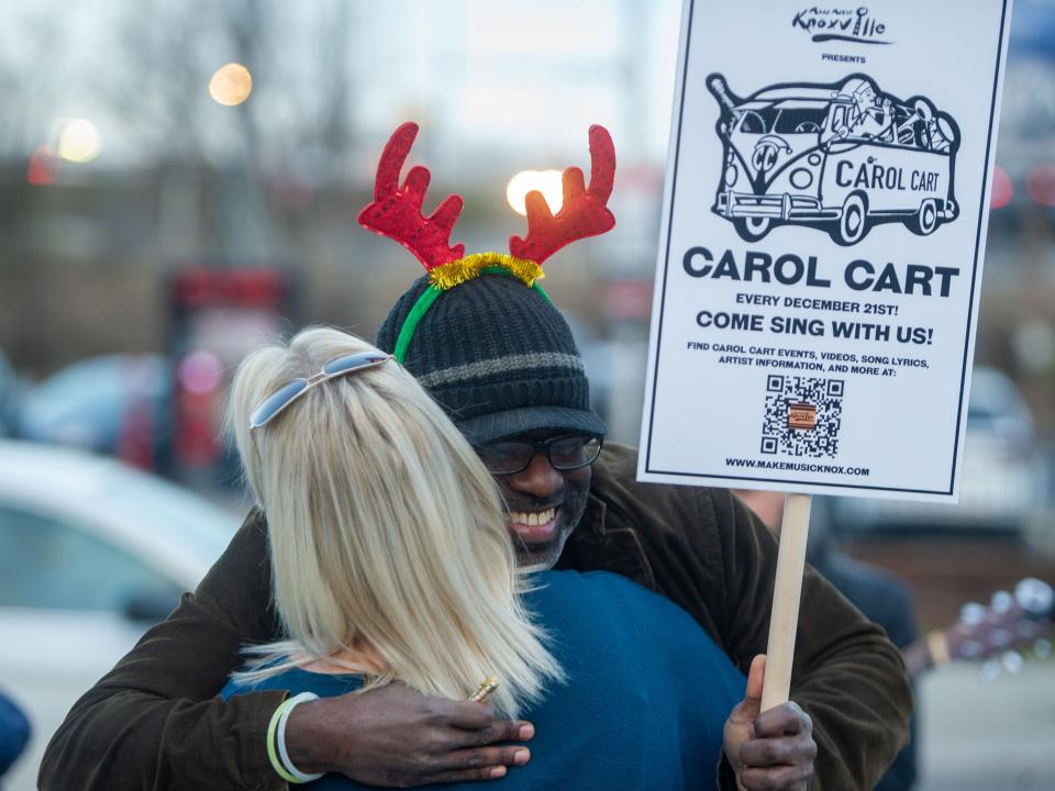 People connect through music during the annual Carol Cart parade.