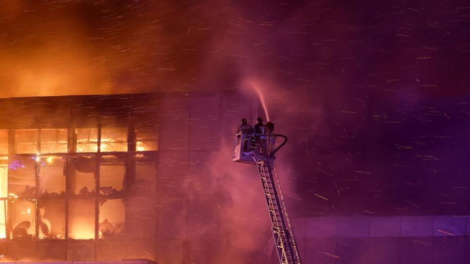 PHOTO: Rescuers work to extinguish fire at the burning Crocus City Hall concert venue following a shooting incident, outside Moscow, Russia, Mar. 22, 2024.  (Maxim Shemetov/Reuters)