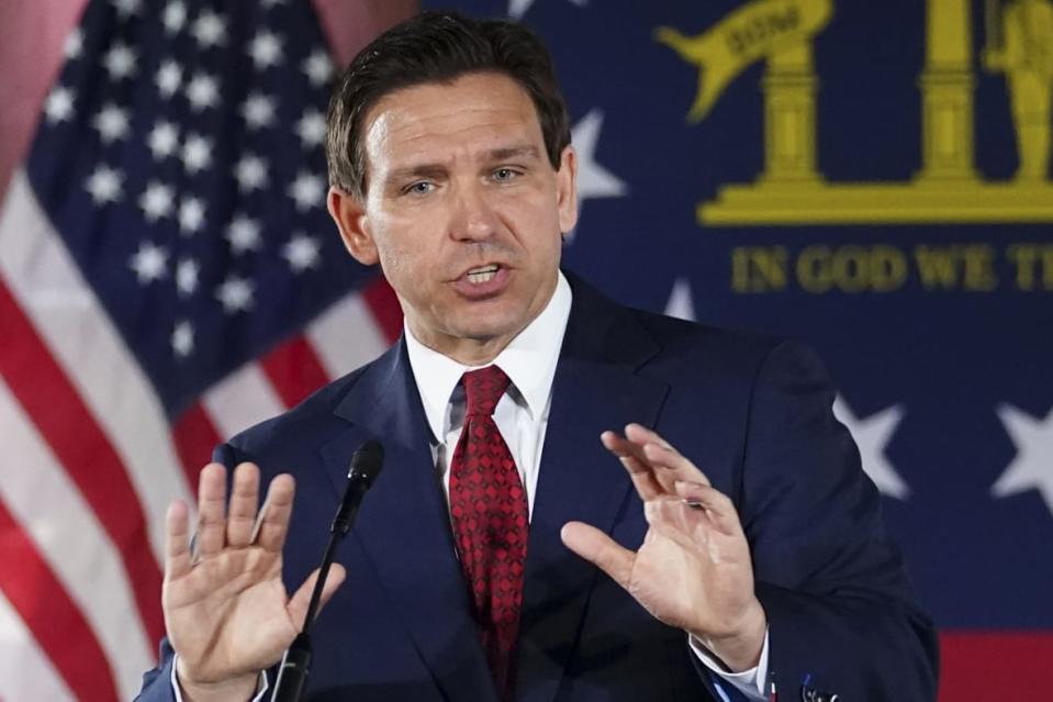 FILE – Florida Gov. Ron DeSantis speaks to a crowd at Adventure Outdoors gun store, Thursday, March 30, 2023, in Smyrna, Ga. DeSantis has proposed legislation this year to ban diversity, equity and inclusion offices as part of a broader agenda to reshape higher education. (AP Photo/John Bazemore, File)