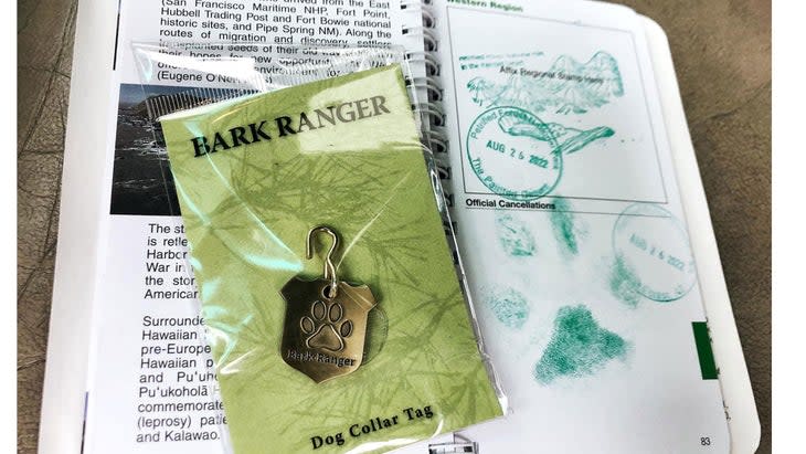 <span class="article__caption">Some dog-friendly national parks issue “Bark Ranger” tags to visiting canines like Ranger, who also stamped his paw on his park passport.</span> (Photo: Courtesy Brad Sailer)