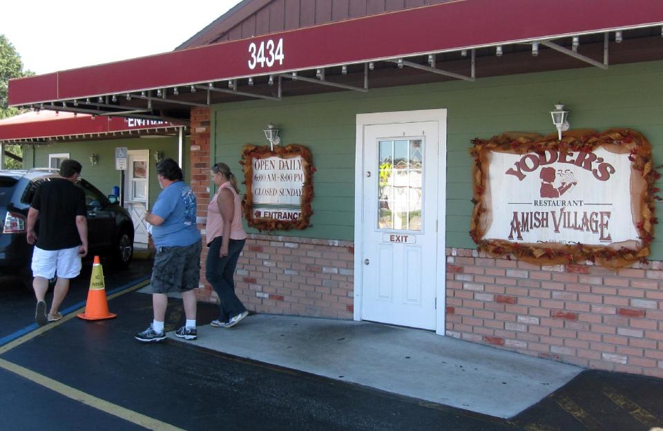 This Oct. 12, 2013 image customers exit Yoder’s Restaurant in Sarasota, Fla. The restaurant is known for “homestyle Amish food” and is popular with locals and tourists alike. (AP Photo/Beth J. Harpaz)
