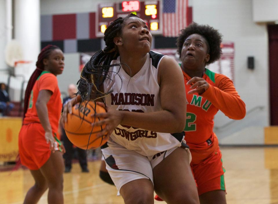 Madison County senior center Dakayla Hopkins (33) goes up for a layup in a game against FAMU DRS on Jan. 22, 2022, at Madison County High School. The Rattlers won 58-31.