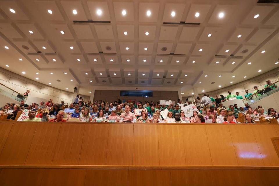 Parents wanting to speak at a CMS school board meeting trickle into the meeting chamber on Tuesday, April 23, 2023 at the Charlotte Mecklenburg Government Center .