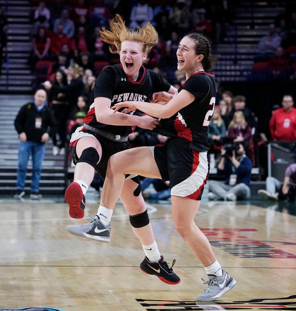 Pewaukee's Amy Terrian, left, and Giselle Janowski celebrate their victory over Notre Dame Academy in the WIAA Division 2 girls state championship game on March 9 at the Resch Center in Green Bay. Pewaukee captured its first state title with the victory.