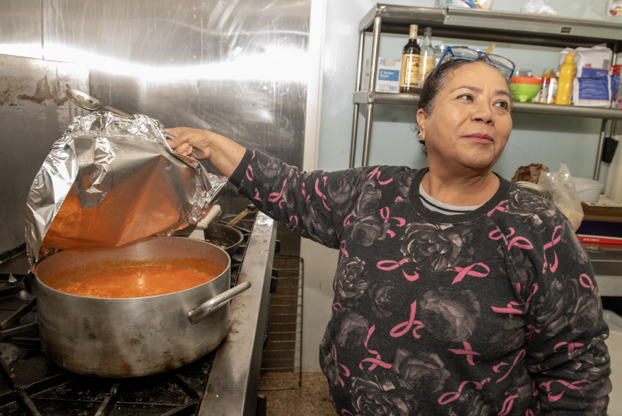 Josefina Hernandez shows her Mexican rice cooking on the stove at Don Jose Mexican Cuisine.