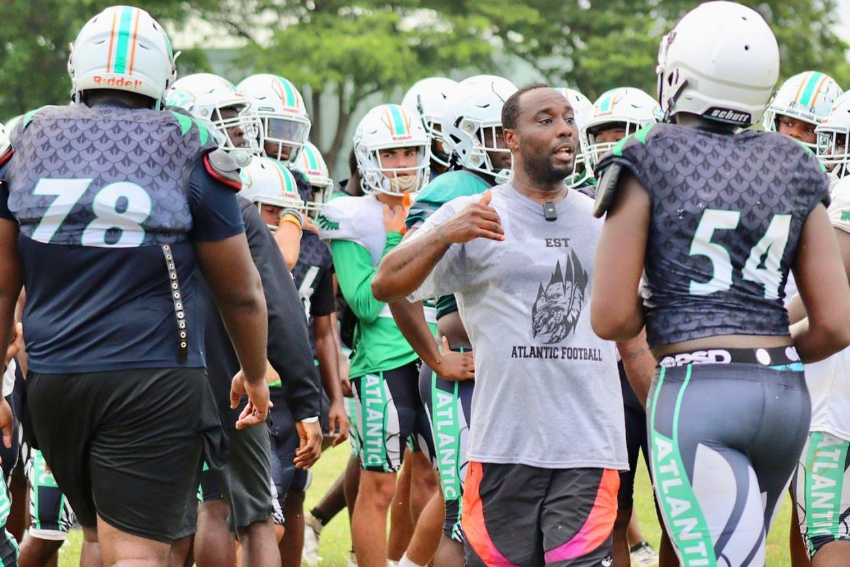 Atlantic coach Jamelle Murray instructs players at practices just one week before the Eagles' season kicks off against Palm Beach Central on Aug. 17.