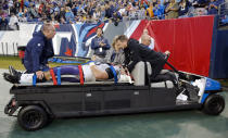 Baltimore Ravens guard Alex Lewis is taken off the field after being injured in the second half of an NFL football game between the Ravens and the Tennessee Titans Sunday, Oct. 14, 2018, in Nashville, Tenn. (AP Photo/James Kenney)