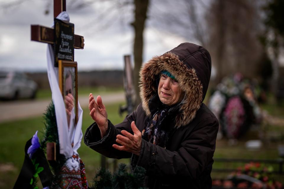 Valentyna Nechyporenko, 77, mourns at the grave of her 47-year-old son Ruslan, during his funeral (Copyright 2022 The Associated Press. All rights reserved.)