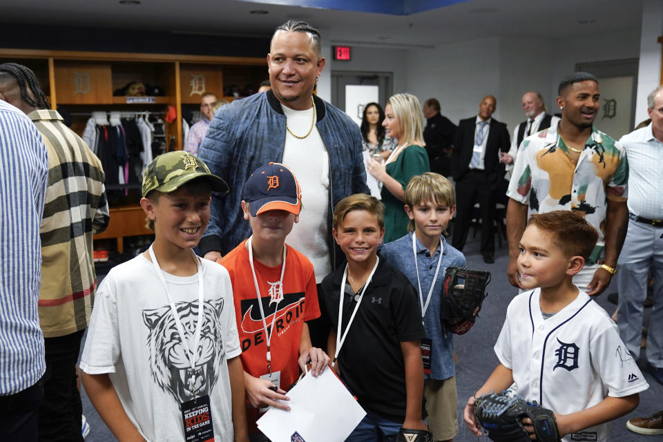 Detroit Tigers' Miguel Cabrera poses with children at a Keeping Kids in the Game event at Comerica Park Thursday, Aug. 24, 2023, in Detroit. Cabrera, one of the greatest hitters of all time, is retiring after the Tigers wrap up their season Sunday, Oct. 1, 2023, and baseball’s last Triple Crown winner is leaving a lasting legacy in the game and his native Venezuela. (AP Photo/Paul Sancya)