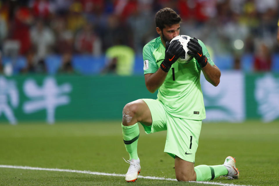 <p>Brazil goalkeeper Alisson kisses the ball after makes a save during the group E match between Serbia and Brazil, at the 2018 soccer World Cup in the Spartak Stadium in Moscow, Russia, Wednesday, June 27, 2018. (AP Photo/Matthias Schrader) </p>