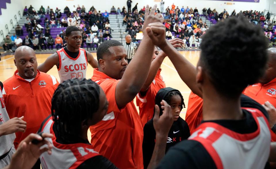 Walnut Ridge coach Chuck Jefferson, center, said senior point guard Dominique Aekins is a "dynamic" playmaker whose "best basketball is ahead of him."