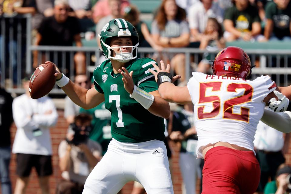 Ohio quarterback Kurtis Rourke, left, drops back to pass in front of Iowa State defensive end Joey Petersen during an NCAA college football game Saturday, Sept. 16, 2023 in Athens, Ohio. (AP Photo/Paul Vernon)