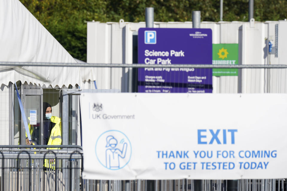 A COVID-19 testing sight opposite Wolverhampton Science Park, England, where the Immensa Health laboratory is based Friday, Oct. 15, 2021. British health officials said Friday that 43,000 people may have been wrongly told they don’t have the coronavirus because of problems at a private laboratory. The U.K. Health Security Agency said the Immensa Health Clinic Ltd. lab in Wolverhampton, central England has been suspended from processing swabs after the false negatives. Will Welfare, the agency’s public health incident director, said it was working “to determine the laboratory technical issues” behind the inaccurate tests. (Jacob King/PA via AP)