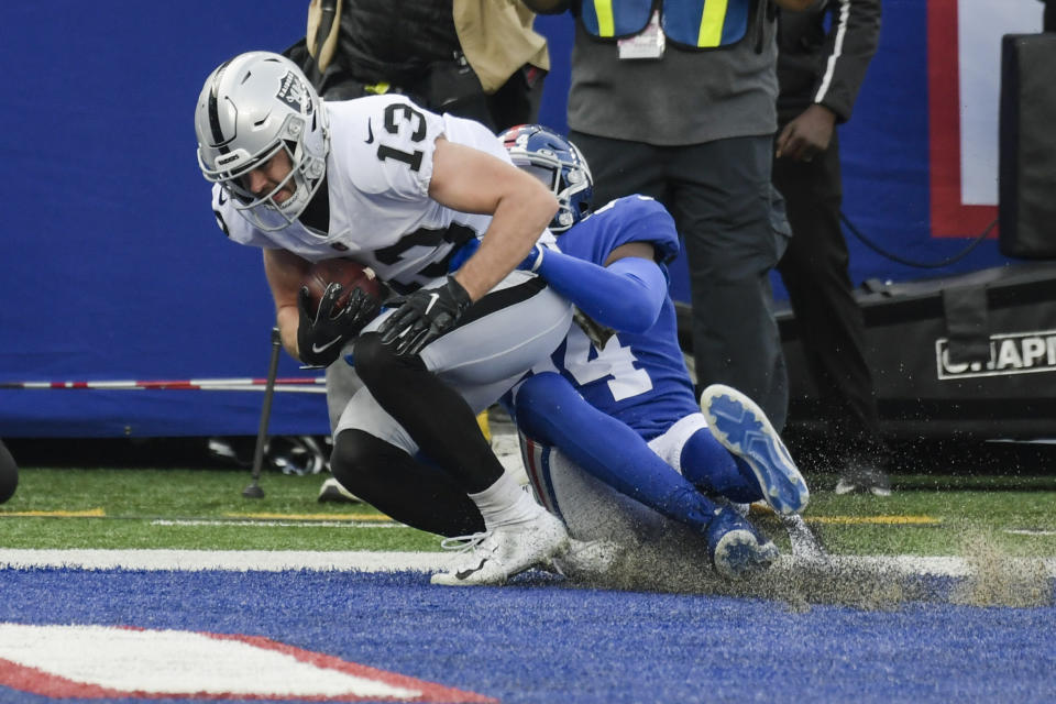 Las Vegas Raiders' Hunter Renfrow (13) catches a pass in the end zone for a touchdown as he is tackled by New York Giants' James Bradberry during the first half of an NFL football game, Sunday, Nov. 7, 2021, in East Rutherford, N.J. (AP Photo/Bill Kostroun)