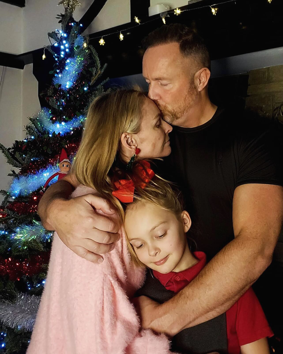 MAFS expert Mel Schilling hugging her husband Gareth and their eight-year-old daughter.