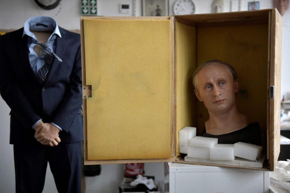 The wax statue of Russian President Vladimir Putin is being packed is a box before it is stored as a reaction to Russia's invasion of Ukraine  (AFP via Getty Images)