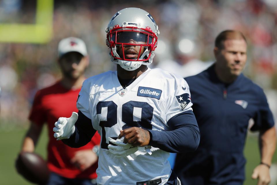 New England Patriots running back James White warms up during an NFL football practice, Saturday, July 31, 2021, in Foxborough, Mass. (AP Photo/Michael Dwyer)