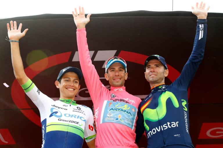 Italy's Vincenzo Nibali (C) of team Astana, winner, Colombia's Esteban Chaves of team Orica (L), second, and Spain's Alejandro Valverde of team Movistar, on the podium after winning the 99th Giro d'Italia