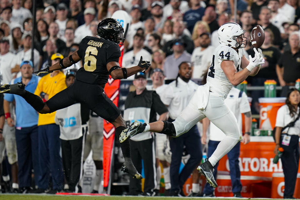 Penn State tight end Tyler Warren (44) drops a pass in front of Purdue linebacker Jalen Graham (6) during the second half of an NCAA college football game in West Lafayette, Ind., Thursday, Sept. 1, 2022. (AP Photo/Michael Conroy)