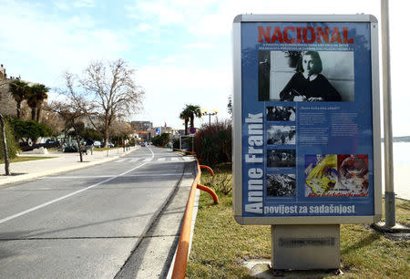 A billboard advertising an exhibition about Anne Frank is seen in the center of Sibenik, Croatia, February 5, 2017. REUTERS/Antonio Bronic