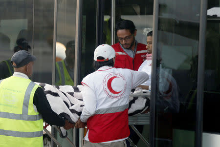 Yemeni Red Crescent staffers carry Saudi prisoner Moussa Awaji from a bus to board an ICRC plane at the Sanaa airport after he was released by the Houthis in Sanaa, Yemen January 29, 2019. REUTERS/Khaled Abdullah