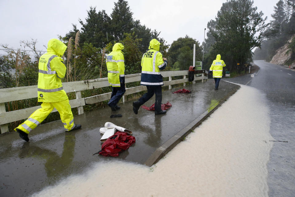 Police and rescuers wait at a roadblock during the search for a student who went missing on a school trip to New Zealand's Abbey Caves in Whangarei, May 9, 2023. / Credit: Michael Cunningham/Northern Advocate via AP