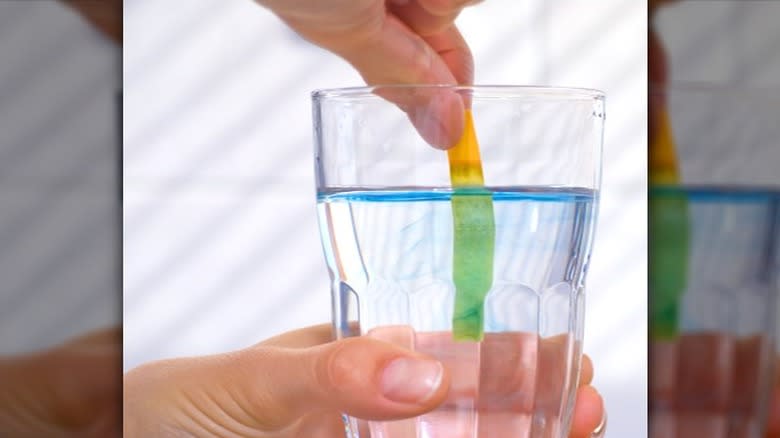 pH test strip in water