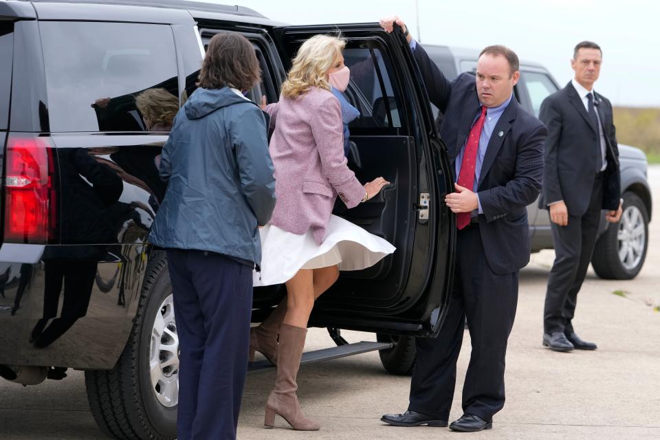 Jill Biden waves when arriving for her flight to Naples (AP)