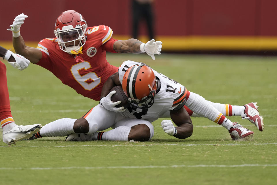 Cleveland Browns wide receiver Donovan Peoples-Jones (11) catches a pass for a first down as Kansas City Chiefs safety Bryan Cook (6) defends during the first half of an NFL preseason football game Saturday, Aug. 26, 2023, in Kansas City, Mo. (AP Photo/Charlie Riedel)