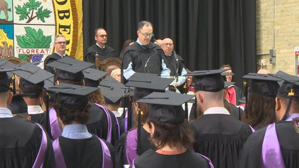 Dr. Peter Nickerson, dean of the University of Manitoba's Max Rady College of Medicine, is seen reciting the physician's pledge for graduates at their May 16 convocation.