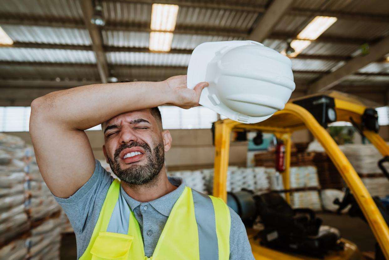 Warehouse employees frequently lack control over their own schedules. <a href="https://www.gettyimages.com/detail/photo/exhausted-warehouse-worker-royalty-free-image/1413866834" rel="nofollow noopener" target="_blank" data-ylk="slk:Andres Oliveira/E+ via Getty Images;elm:context_link;itc:0;sec:content-canvas" class="link ">Andres Oliveira/E+ via Getty Images</a>