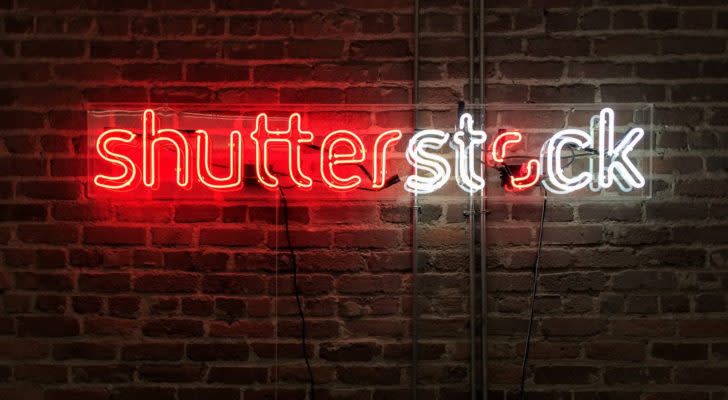 Neon sign of the Shutterstock logo glowing against an exposed brick wall in the San Francisco office of Shutterstock, Inc. (NYSE: SSTK).