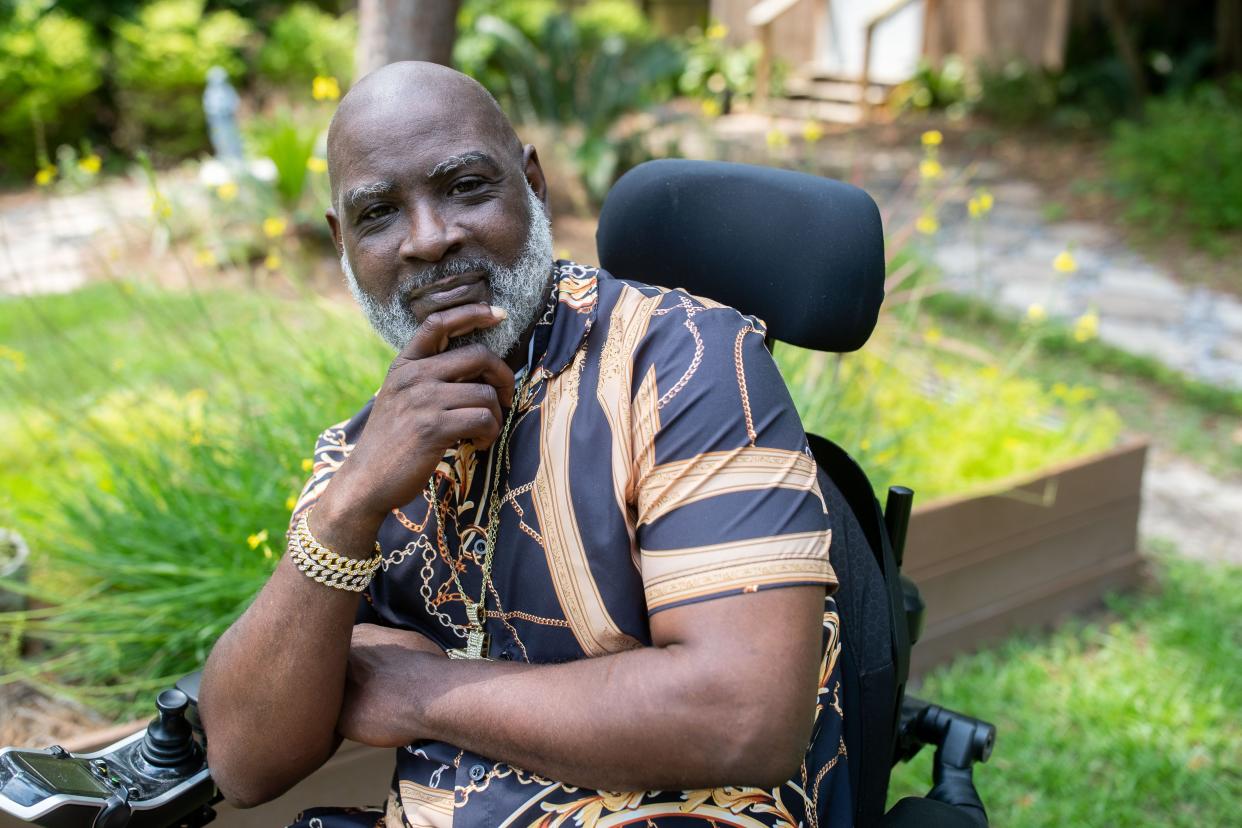 Joe Sullivan, 48, poses for a portrait in the backyard of the Joseph House on Thursday, May 9, 2024.