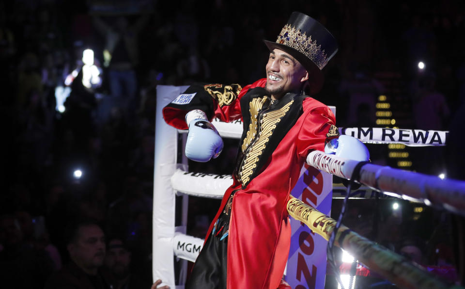 WBO junior welterweight champion Teofimo Lopez makes his ring entrance for a boxing bout against Jamaine Ortiz on Thursday, Feb. 8, 2024, in Las Vegas. Lopez retained his title with a unanimous decision. (Steve Marcus/Las Vegas Sun via AP)