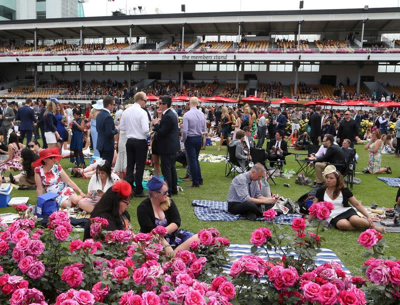 FILE PHOTO: Racegoers enjoying the atmosphere during the Melbourne Cup race day at Flemington Racecourse
