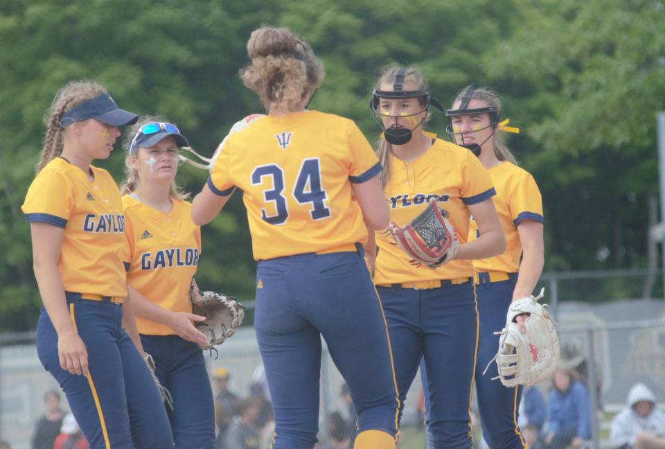 Members of the Gaylord softball team celebrate an out during the 2022 regional finals matchup with Escanaba. All of the girls pictured went on to have successful summer seasons with their respective travel teams.