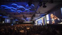 U.S. President Barack Obama is seen on a large monitor as he speaks during the Clinton Global Initiative 2013 (CGI) in New York September 24, 2013. REUTERS/Carlo Allegri (UNITED STATES - Tags: POLITICS)