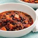 <p>Make a double batch of this quick vegetarian chili, full of black beans and sweet potatoes, and eat it for lunch the next day or freeze the extras for another night. We love the smoky heat from the ground chipotle, but omit it if you prefer a mild chili. Serve with tortilla chips or cornbread and coleslaw.</p>