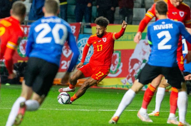 Sorba Thomas, centre, controls the ball during the clash against Estonia