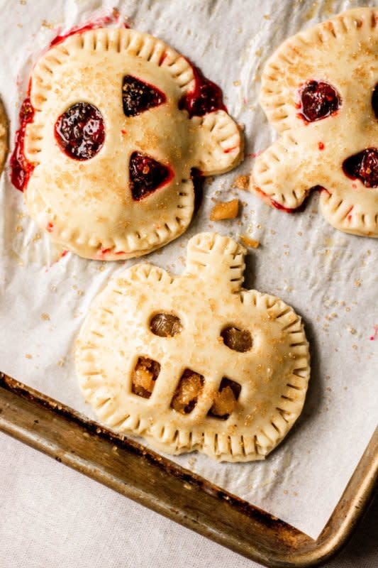 <p>So Much Food</p><p>These cute little hand pies are the perfect little dessert for your Halloween party!</p><p><strong>Get the recipe: <a href="https://somuchfoodblog.com/2019/10/15/jack-o-lantern-hand-pies/" rel="nofollow noopener" target="_blank" data-ylk="slk:Jack-O'-Lantern Hand Pies;elm:context_link;itc:0;sec:content-canvas" class="link rapid-noclick-resp">Jack-O'-Lantern Hand Pies</a></strong></p>