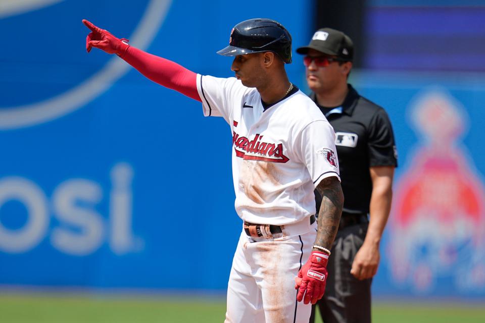 Cleveland Guardians' Brayan Rocchio gestures to the dugout from second base after hitting a RBI double in the second inning of a baseball game against the Toronto Blue Jays Thursday, Aug. 10, 2023, in Cleveland. (AP Photo/Sue Ogrocki)