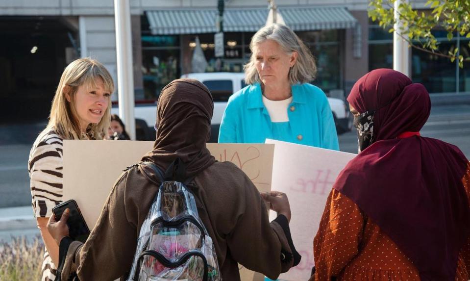 Boise city council members Holli Woodings and Elaine Clegg briefly meet with members of Boise’s East African community and other Black Lives Matter supporters in front of City Hall on Tuesday as they protest the police shooting of Mohamud Hassan Mkoma.