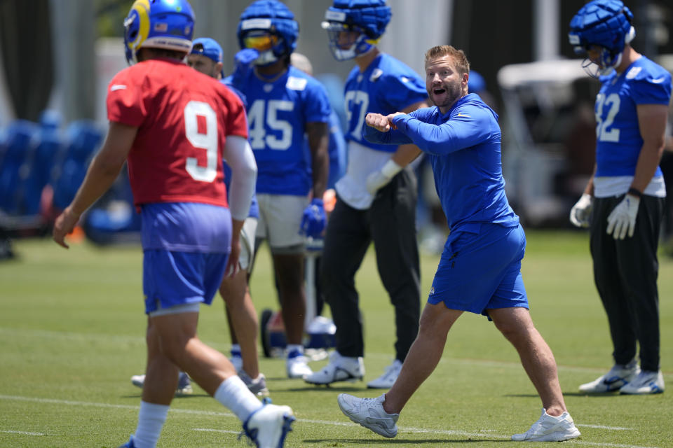 Los Angeles Rams' head coach Sean McVay, right, gestures at quarterback Matthew Stafford (9) during an NFL football organized team activity Tuesday, May 21, 2024, in Thousand Oaks, Calif. (AP Photo/Ryan Sun)